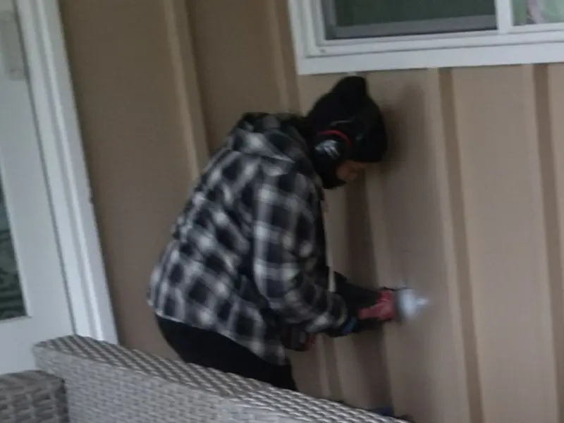 Professional electrician installing an exterior outlet in Chickamauga
