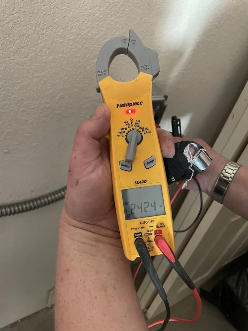 Voltage testing with clamp meter during Outlet Installation in Chickamauga